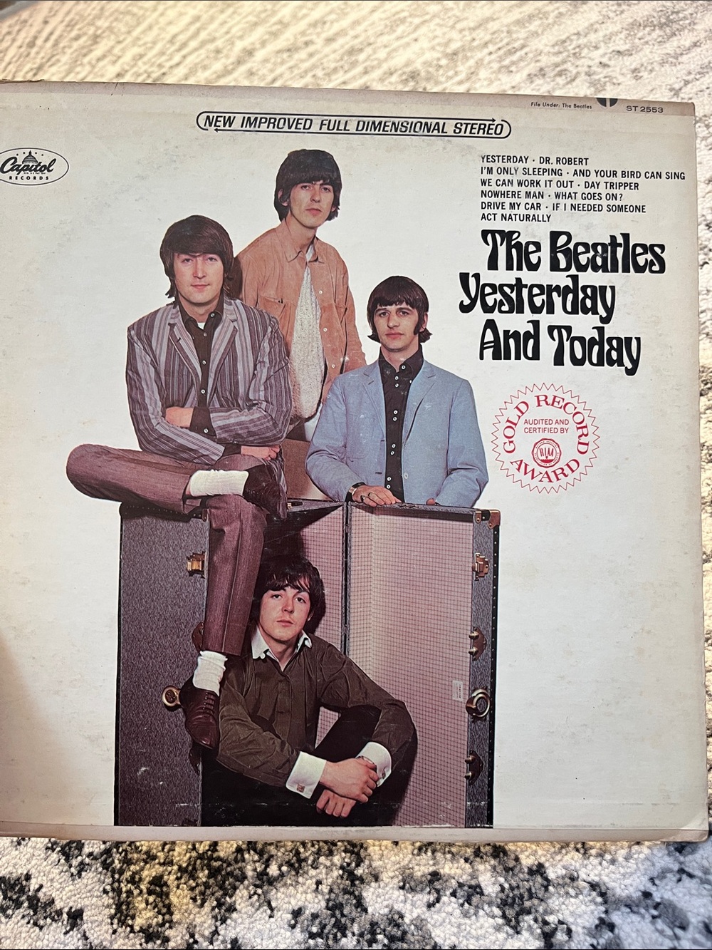 The Beatles Vintage Album Cover Featuring Band in Muted Tones
